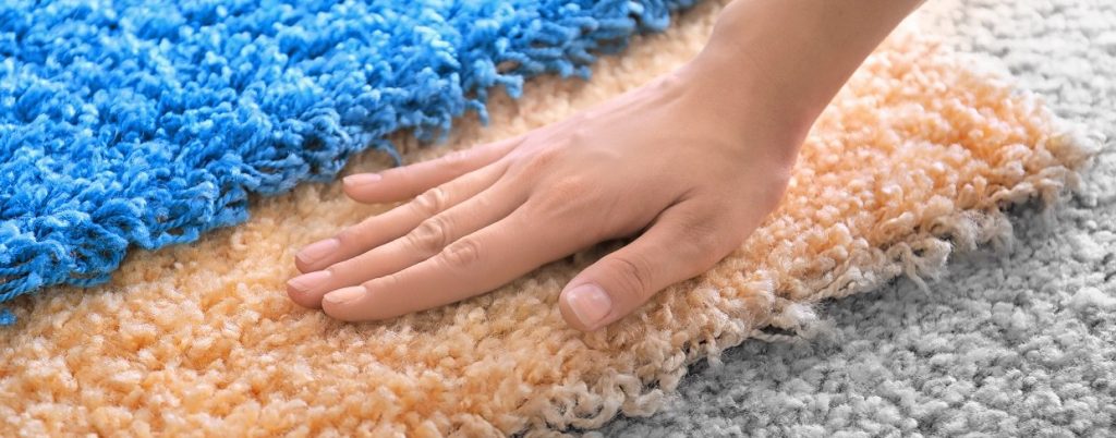 Southern Flooring Company, Woman choosing carpet, closeup